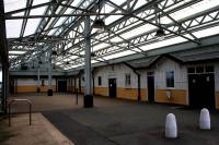 Interior view of Pwllheli station on 14th October 2015. The station cafe now occupies most of the west face of the building. The single remaining platform is off to the left.<br><br>[Colin McDonald 14/10/2015]