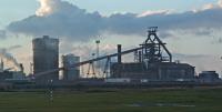 The massive single blast furnace at Redcar was blown in for the first time in 1979, leading to the closure of the three smaller furnaces at Cleveland Iron Works. This 2004 view is from the trackbed of the original alignment of the Middlesbrough and Redcar Railway which was realigned south in 1978 (with a private station for the works) to allow construction of the furnace and the hot metal road to Lackenby Steelworks. The site has a long history of metal making - being the Coatham Ironworks (1873), then the Redcar Iron and Steel works and is now the Redcar Ironworks.<br><br>[Ewan Crawford 29/02/2004]