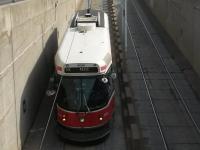 Toronto Transat Commission service 512 travelling on St Claire Avenue West on 3rd October 2015 about to enter a tunnel section between Bathurst Street and Vaughan Road on the route to Keele.<br><br>[Brian Smith 03/10/2015]