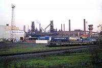 A small part of the extensive Appleby Frodingham Steelworks by Scunthorpe. Part of the Caparo works is visible to the left and beyond are two of the blast furnaces. View looks east.<br><br>[Ewan Crawford 29/11/2004]