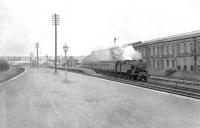 A Rutherglen - Balloch train leaving Dalmuir Riverside station on 23 June 1959. The locomotive is Polmadie shed's Fairburn 2-6-4T no 42057. The photograph is taken from the terminal platforms used for worker's trains. <br><br>[G H Robin collection by courtesy of the Mitchell Library, Glasgow 23/06/1959]