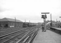 Looking south from platform 3 at Carlisle on 27 June 1964 as Holbeck based Black 5 no 44853 arrives with a local from Hellifield.<br><br>[John Robin 27/06/1964]