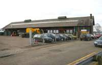 The large former goods shed on the east side of Carluke station, seen here in March 2006. The building was being used by an agricultural supplies company at that time. The station itself stands behind the structure. [Ref query 34178]<br><br>[John Furnevel 10/03/2006]