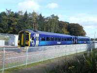 The ever present palisade fencing on the new Borders Railway means you have to get a bit of height to photograph the trains and I risked doing myself a mischief taking this one by straddling some steps on two fence posts. 158782 approaches the points at Tweedbank and joins the single line to Bowland Junction with an afternoon service to Edinburgh on 20th October 2015.<br><br>[David Panton 20/10/2015]