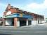 The white semi-circle over the entrance once displayed a rising sun accompanied by the words <I>'City of Carlisle Electric Tramways Company'</I>. The former Lindisfarne Street tram depot, looking north east across London Road in May 2003, at that time in use as a tool and equipment hire centre. [See image 9684] <br><br>[John Furnevel 13/05/2003]