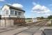 The signalbox at Alrewas, which controls a level crossing on a minor road, marks the start of a short single line section on the line from Lichfield to Wichnor Junction. The station at Alrewas was just behind the camera but all trace has been removed since its closure in 1965. The line is now used for freight movements and also by Voyagers running to and from the nearby Barton-under-Needwood depot. [Ref query 34665] <br><br>[Mark Bartlett 28/08/2015]