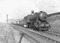 One of Dawsholm shed's WD Austerity 2-8-0s, no 90198, working hard on the approach to Possil Junction on 24 May 1958 with a down coal train. <br><br>[G H Robin collection by courtesy of the Mitchell Library, Glasgow 24/05/1958]