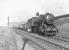 One of Dawsholm shed's WD Austerity 2-8-0s, no 90198, working hard on the approach to Possil Junction on 24 May 1958 with a down coal train. <br><br>[G H Robin collection by courtesy of the Mitchell Library, Glasgow 24/05/1958]