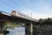 A RENFE Class 447 EMU heads south from Girona and crosses the River Onyar with a stopping train for Barcelona. This bridge is just by the Basilica church on the edge of the old town area of the city. <br><br>[Mark Bartlett 17/09/2015]