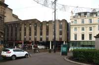 The unprepossessing Millenium Hotel extension currently completely obscures the roof of the station when viewed from George Square. It is due to be demolished in the refurbishment of the station which will see platforms extended into the present concourse.<br><br>[Colin McDonald 24/10/2015]