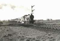 Ex-LMS 4F 0-6-0 44331 approaching the site of Monkton Junction with a northbound freight on 28 March 1959. The town of Prestwick stands in the background. [Ref query 3418]<br><br>[G H Robin collection by courtesy of the Mitchell Library, Glasgow 28/03/1959]