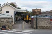 Platform 3 at Liskeard, for services to Looe,  is at right angles to the main line which is behind the photographer. This view looks north and 153305 will head north, curve 180 degrees to the right, under the mainline and then through 180 degrees to the right again to Combe Jct where it reverses to head south to Looe. Quite an operation to loose height.<br><br>[John McIntyre 14/10/2015]