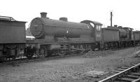 Ex-GCR Robinson class O4 2-8-0 no 63631 in the sidings alongside Gorton shed on 10 August 1962, approximately one month prior to official withdrawal by BR. <br><br>[K A Gray 10/08/1962]