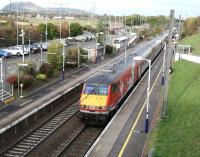 The Virgin Trains East Coast 1000 Edinburgh Waverley - London Kings Cross runs south through Musselburgh station on Sunday 25 October 2015.<br><br>[John Furnevel 25/10/2015]