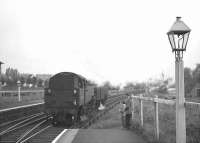 Standard and Fairburn 2-6-4 tanks run light through Busby station on 6 June 1963 on their way back to Glasgow from East Kilbride. <br><br>[John Robin 06/06/1963]