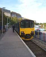 The driver of the St Erth to St Ives shuttle service changes ends at St Ives to prepare for the return on 16 October 2015. In the sky above the unit a parachutist drifts down.<br><br>[John McIntyre 16/10/2015]