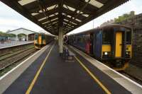 On the left a Plymouth to Penzance stopping service departs from Truro while on the right in the bay platform the service to Falmouth Docks waits for the line west.<br><br>[John McIntyre 14/10/2015]