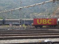 With a person seated above the rear buffer of the leading wagon, a lengthy loaded intermodal rake is being propelled into the SNCF/RENFE interchange yard by Portbou station by SNCF Fret Bo-Bo loco 469-203. Such activities are no doubt totally forbidden in the UK today but at one time...[See image 26114] <br><br>[David Pesterfield 07/08/2015]