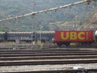 With a person seated above the rear buffer of the leading wagon, a lengthy loaded intermodal rake is being propelled into the SNCF/RENFE interchange yard by Portbou station by SNCF Fret Bo-Bo loco 469-203. Such activities are no doubt totally forbidden in the UK today but at one time...[See image 26114] <br><br>[David Pesterfield 07/08/2015]