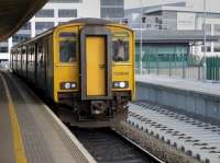 Improvement work continues at Cardiff Central. 150242 pauses alongside the new Platform 8 with the 15.36 to Treherbert on 20 October 2015.<br><br>[Bill Roberton 20/10/2015]