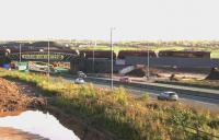 An empty coal train from Longannet to Hunterston passes over the bridges at Bargeddie on 29th October 2015. These trains will cease on the closure of Longannet Power Station at the end of March 2016. <br><br>[Colin McDonald 29/10/2015]