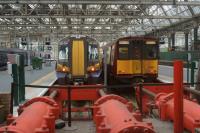 Two generations of EMU at the buffers on platforms 6 and 7, Glasgow Central on 02 August 2015. The future destination for 380004 was not noted but 314207 was scheduled for the 1653 hrs to Neilston.<br><br>[John McIntyre 02/08/2015]