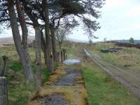 View west at Loch Skerrow in 2003. In the distant right is the eastbound platform and the remains of the watertank supports. Above and to the left is the railway cottage.<br><br>[Ewan Crawford 21/05/2003]