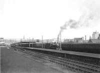 One of Ardrossan shed's 2P 4-4-0s, no 40608, at Largs on 27 February 1954 with a train for St Enoch. <br><br>[G H Robin collection by courtesy of the Mitchell Library, Glasgow 27/02/1954]