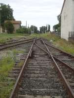 The pointwork at the east end of St-Jean-Pla-de-Corts yard with the through line from Ceret running straight ahead to cross Route de Vives level crossing en route towards Le Boulou and branch to main line connection at Elne. A loading siding alongside a large storage pad is on the south side of the through line, with a stabling siding on the north side. [See image 52438] for view in opposite direction<br><br>[David Pesterfield 01/08/2015]