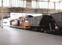 EWS 60083 - appropriately named <I>'Shining Tor'</I> - rumbles north through Carlisle on 11 August 1997 with coal empties.<br><br>[John Furnevel 11/08/1997]