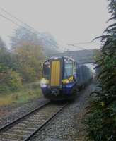 The headlights show up the sea mist as a 380 crawls to a stop at North Berwick in the atmospheric afternoon of 03/11/2015. The signal box used to be by Ware Road bridge. Today the nearest signal is 4 miles away at the approach to Drem Junction; the branch is really a long siding.<br><br>[David Panton 03/11/2015]