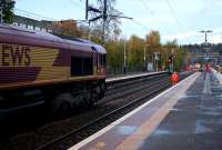 Photographed from just outwith the site boundary, an engineering train waits at the down platform during the engineering possession on 7-8th November 2015. Half of the new crossover has been installed just past the signal at the end of the platform. <br><br>[Colin McDonald 07/11/2015]