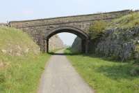 Limestone cutting on the Tissington Trail, mid way between Parsley Hay and Hartington. This view looks back towards the junction south of Parsley Hay where the High Peak trail leaves the old Ashbourne line [See image 39041].  <br><br>[Mark Bartlett 24/05/2012]