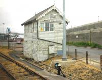 Barrow Road Crossing signal box, as seen from a train departing from (new) New Holland station on the Barton-on-Humber branch. The start of the old line to the New Holland Pier can just be seen curving into the industrial complex that now covers the site of New Holland Town station. The new station opened in 1981 replacing the Town and Pier stations that closed when the Humber Bridge opened and the ferry service was withdrawn. <br><br>[Mark Bartlett 21/05/2012]