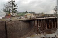 During maintenance of the Caledonian Canal locks in 1996 it was possible to see the detail of the pier which once supported the swing bridge for the line between Fort Augustus station and 'Pier' on Loch Ness. The pivot point was the right end of the pier, which has since been removed. The end of the through platform is marked by a yellow generator on the right.<br><br>[Ewan Crawford //1996]