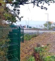 Come along now, don't be shy. 66424 is lurking in the Sainsbury's sidings at DIRFT on 23 October [see image 53055]. View north across the A428 road bridge.<br><br>[Ken Strachan 23/10/2015]