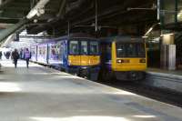 319383 and 142001 share adjacent platforms at Manchester Victoria under the MEN Arena on 9 October 2015.<br><br>[John McIntyre 09/10/2015]