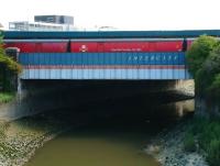 A train of Royal Mail TPO vehicles lined up across the 'InterCity' bridge over the River Avon on the west side of Bristol Temple Meads station in August 2002. View from Bath Bridge roundabout.<br><br>[Ian Dinmore 02/08/2002]