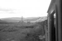 Footplate view from a banking engine preparing to drop off as its train breasts Beattock Summit on 27 June 1964. [See image 45518]<br><br>[John Robin 27/06/1964]