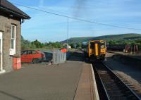 A Sprinter heading for Barry leaves Rhymney in 2003. The MkII coaches in the sidings were used for many years on Class 37 hauled peak hour trains but these ceased in 2005. [See image 7079]<br><br>[Ewan Crawford 21/06/2003]