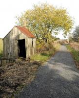 A well preserved surfaceman's hut alongside the old trackbed of the Buchan line at the hamlet of Tillyeve looking north towards nearby Udny along the cycle path in November 2015. [Ref query 8797]<br><br>[Brian Taylor /11/2015]