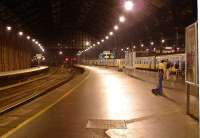 Bicycles at Brighton. Evening scene looking out along platforms 3 & 4 of Brighton station on 24 August 2002, with the time just after 8pm and a long rake of slam door stock at the platform.<br><br>[Ian Dinmore 24/08/2002]