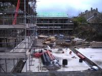 View south east from the in-filled Springwood Road over-bridge, by the junction with Luke Lane and Miry Lane, at Thongsbridge showing building work taking place in a section of the deep cutting of the former Holmfirth branch in November 2015. Thongsbridge was the sole intermediate station and closed to passengers with the branch in 1959.<br><br>[David Pesterfield 12/11/2015]