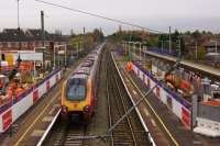 A double Voyager set heads south at Leyland with a service to London via Birmingham on a murky morning, 17 November 2015. Work continues on all platforms with the new footbridge, and the bases to support it, while the trains rush past.<br><br>[John McIntyre 17/11/2015]