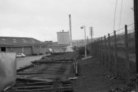 The sidings at the Twin Spires Creamery near Bucksburn in March 1973 whilst track lifting was taking place. The view is towards Aberdeen with the GNSR mainline on the other side of the fence to the right. The track and pointwork were being recovered for re-use on the Strathspey Railway.<br><br>[John McIntyre 04/03/1973]