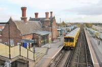 Ellesmere Port station building is still staffed and there is a half hourly Merseyrail service via Hooton and Birkenhead to Liverpool. 507028 waits in the one platform with third rail as the other is only used for trains to Helsby. The passenger service through Stanlow & Thornton and Ince & Elton is pretty abysmal, comprising just two early morning and two mid afternoon trains although there are some freight services too.<br><br>[Mark Bartlett 16/11/2015]