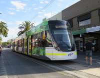 The latest tram type in St. Kilda on a service to Melbourne. This is an E Class, designed for and built in Melbourne by Bombardier. The previous C and D Classes were 'off the shelf' designs from Alstom (<I>Citadis</I>) and Siemens (<I>Advance Combino</I>).<br>
<br><br>[Colin Miller 05/10/2015]