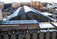 A seagull's eye view of the magnificent train shed roof at Queen Street in November 2015 - plus the excrescence which is the Millenium Hotel extension. The latter is due to be demolished in the refurbishment of the station. Access by kind permission of Merchants House.<br><br>[Colin McDonald 19/11/2015]