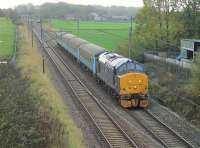 Plain blue 37422 heads north on the WCML at Woodacre with the 1004 (Mon-Fri) Preston to Barrow service on 10th November 2015. A short time earlier the loco had propelled the stock south on a through train from Carlisle.<br><br>[Mark Bartlett 10/11/2015]