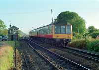 A DMU heading for Cumbernauld passing Greenfoot Level Crossing in 1989.<br><br>[Ewan Crawford //1989]